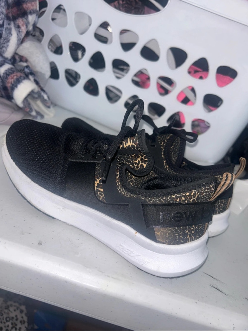New Balance Black Sneakers with Gold Leopard Accents